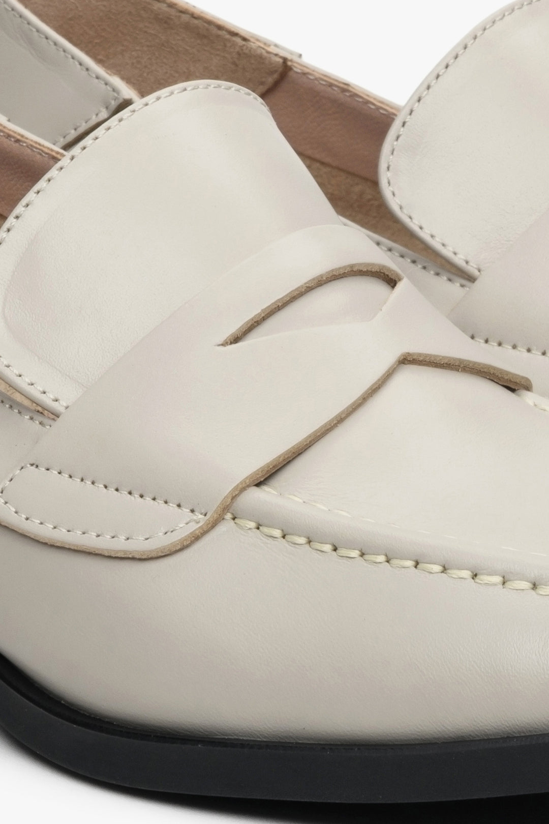 Women's beige leather loafers by Estro - close-up on the stitching pattern.