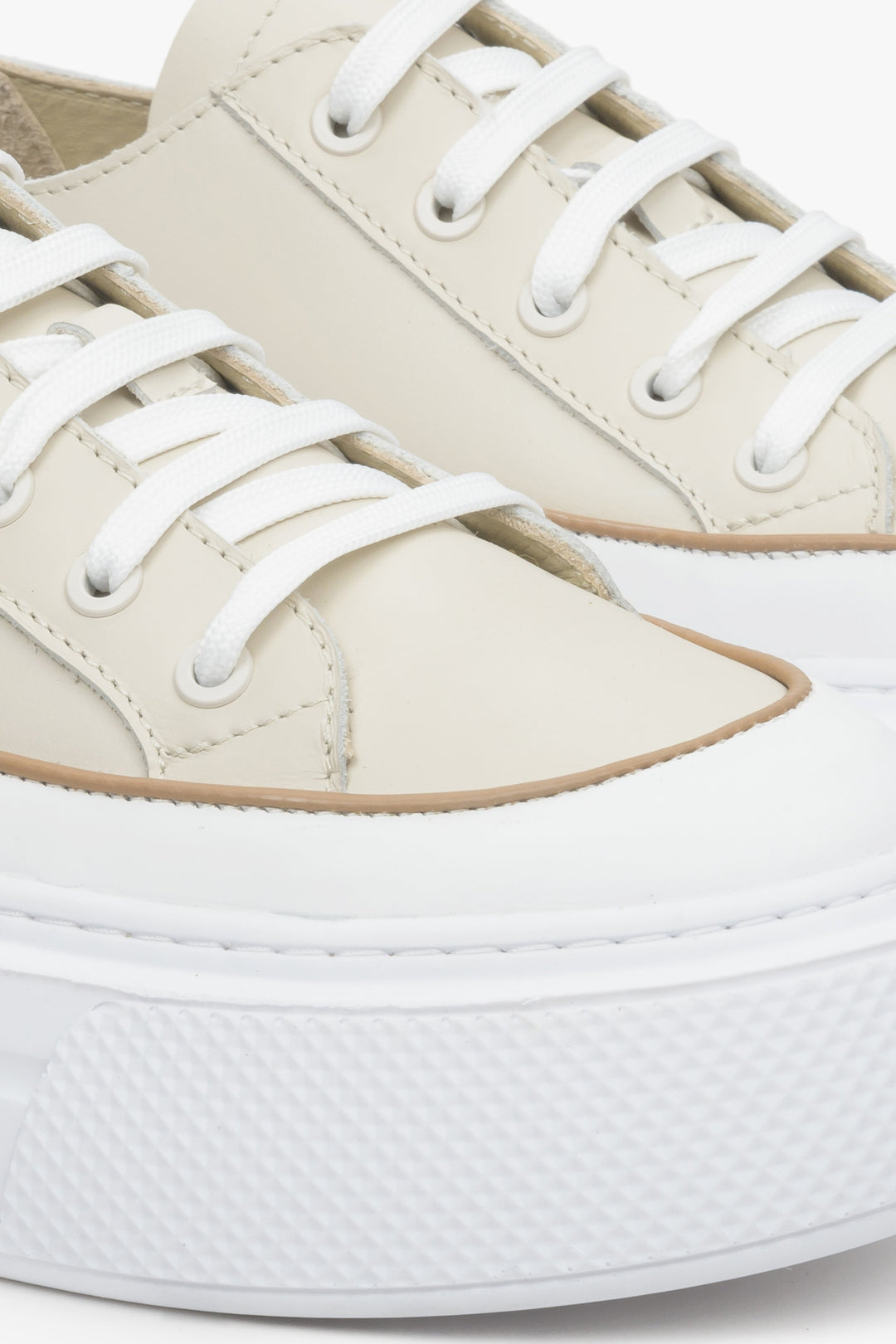 Women's light beige and white leather sneakers - a close up on details.