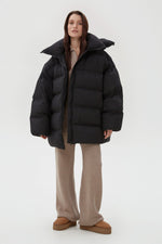 Women's Black Quilted Puffer Jacket with a High Collar Estro ER00113894.