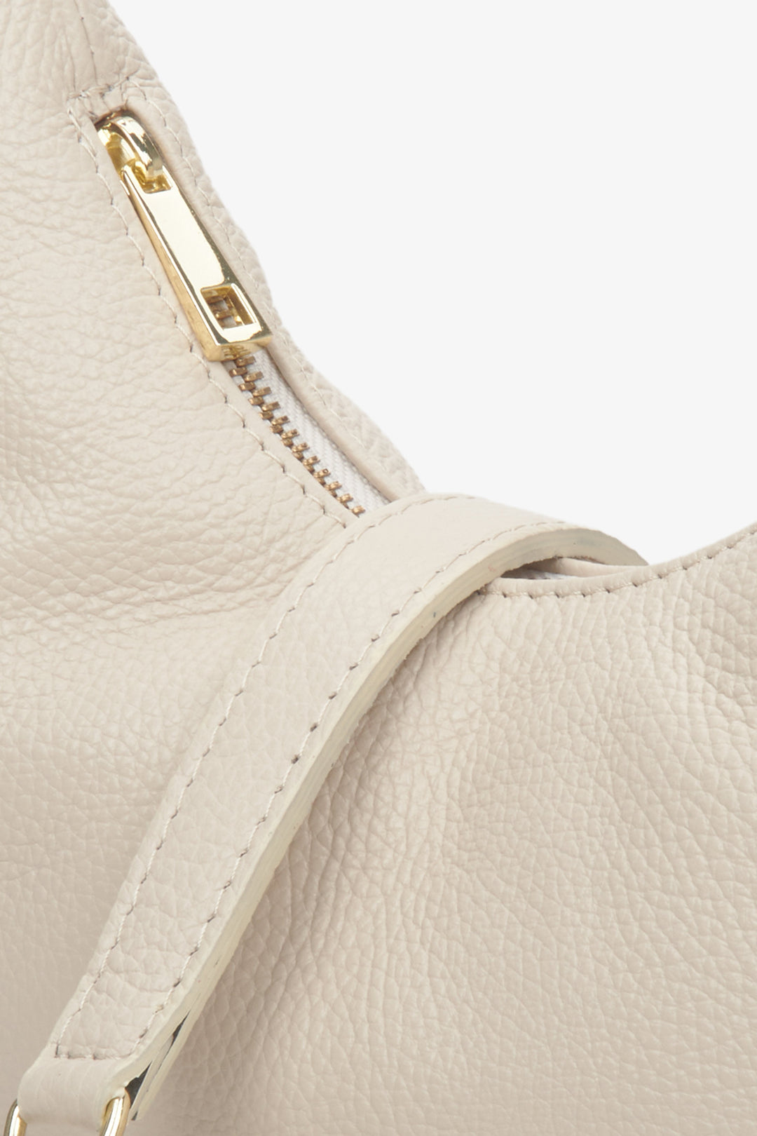 Women's light beige leather handbag by Estro - close-up on details.