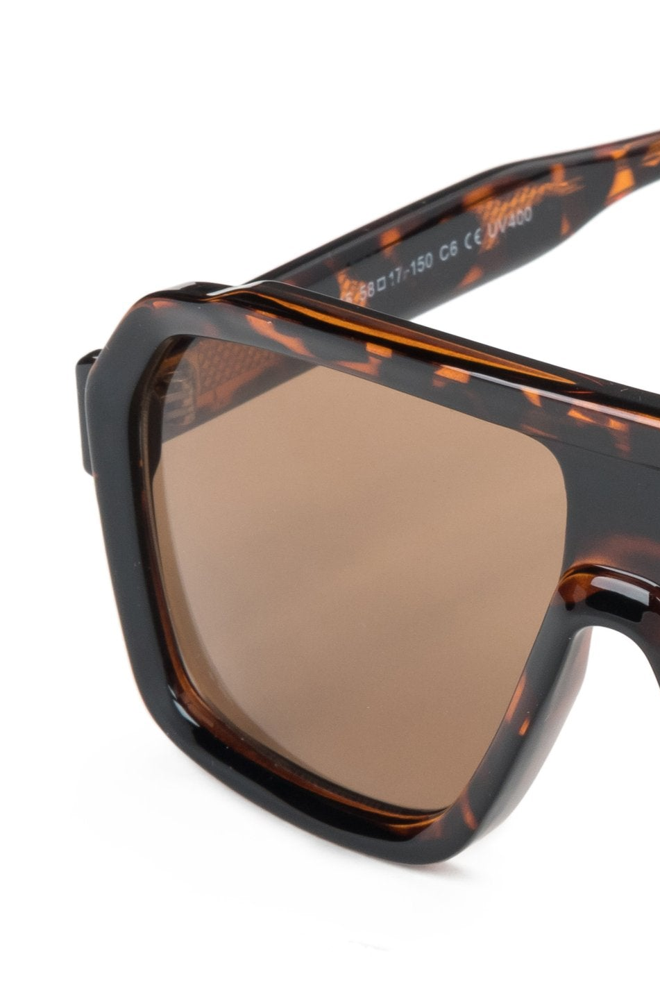 A pair of large brown sunglasses with a distinct geometric shape and leopard print.
