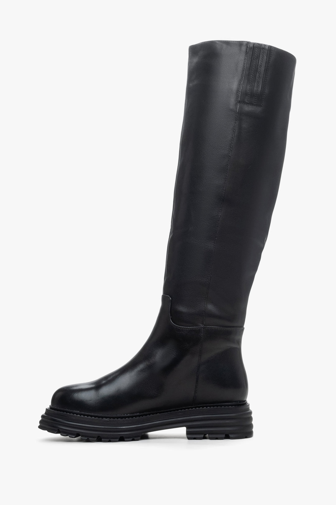 Women's black leather knee-high boots with wide calf - shoe profile.