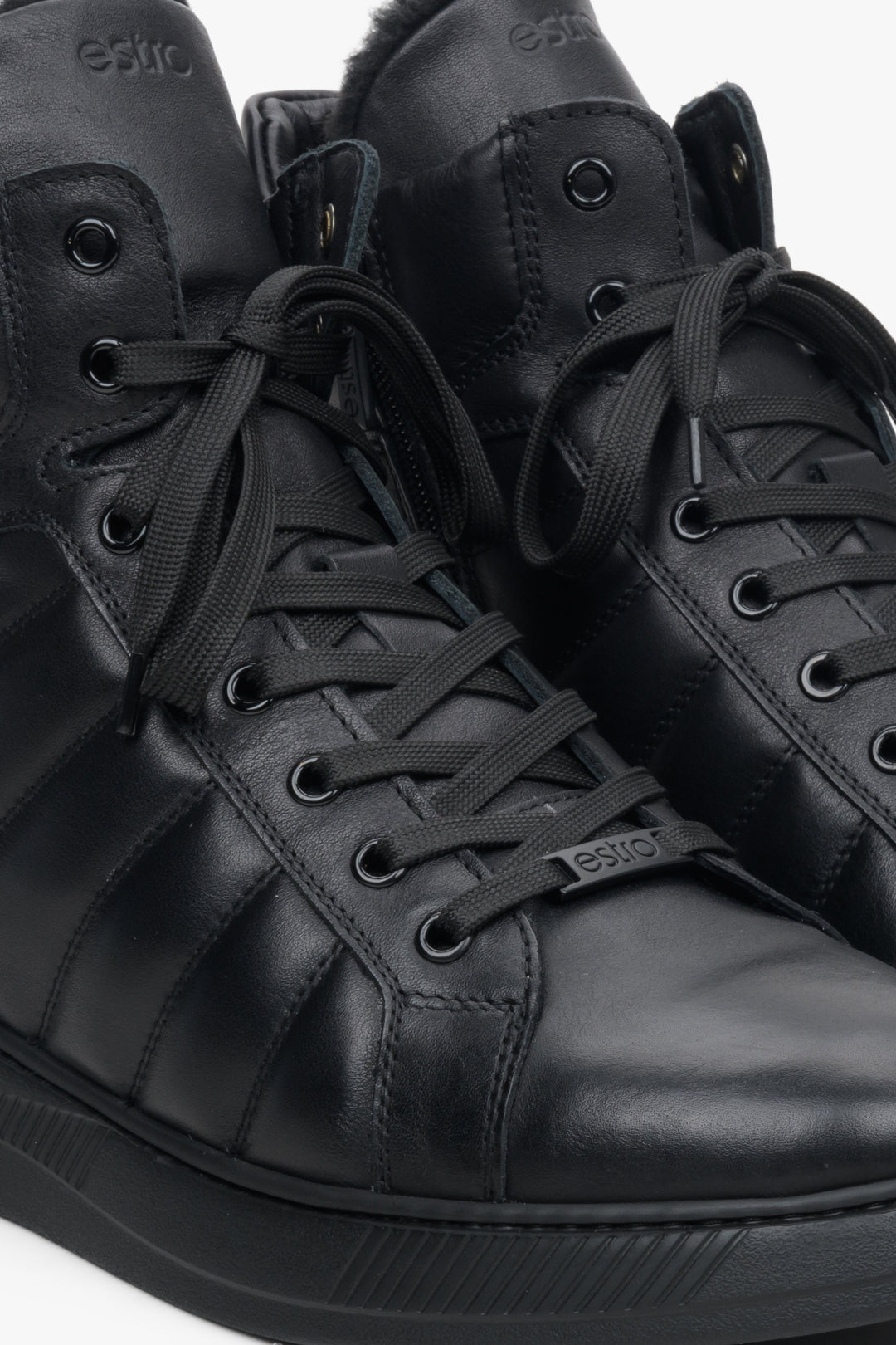 Men's black leather boots by Estro - close-up of the lacing system.