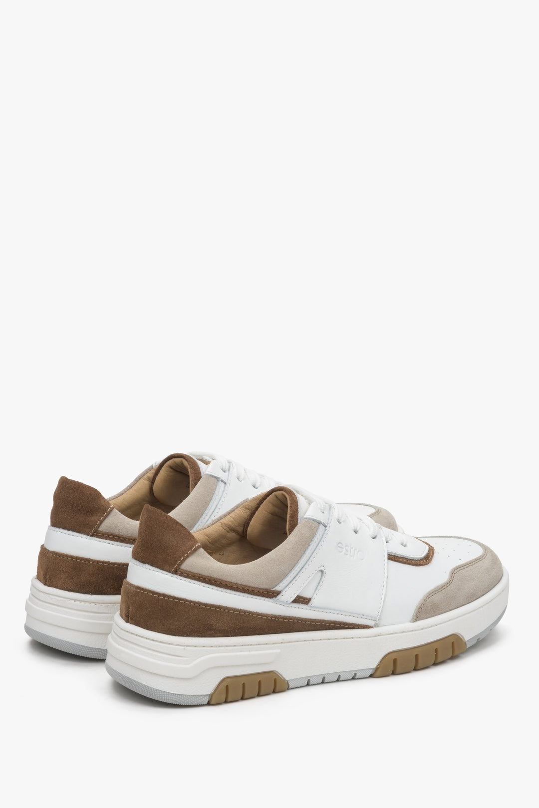 Leather and suede women's sneakers by Estro in beige-brown - close-up on the side seam of the shoe.