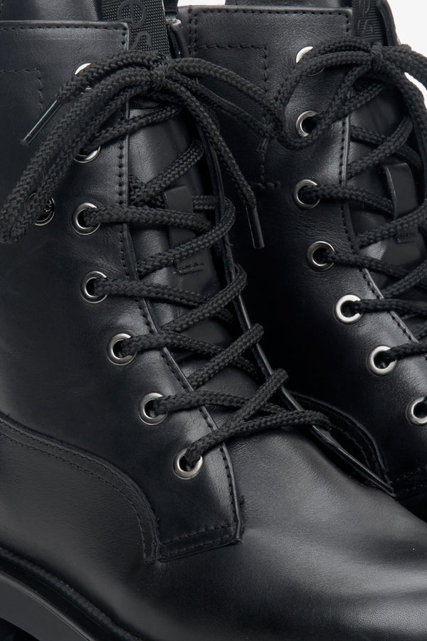 Winter women's boots by Estro made of black genuine leather - close-up of the central part of the boot.