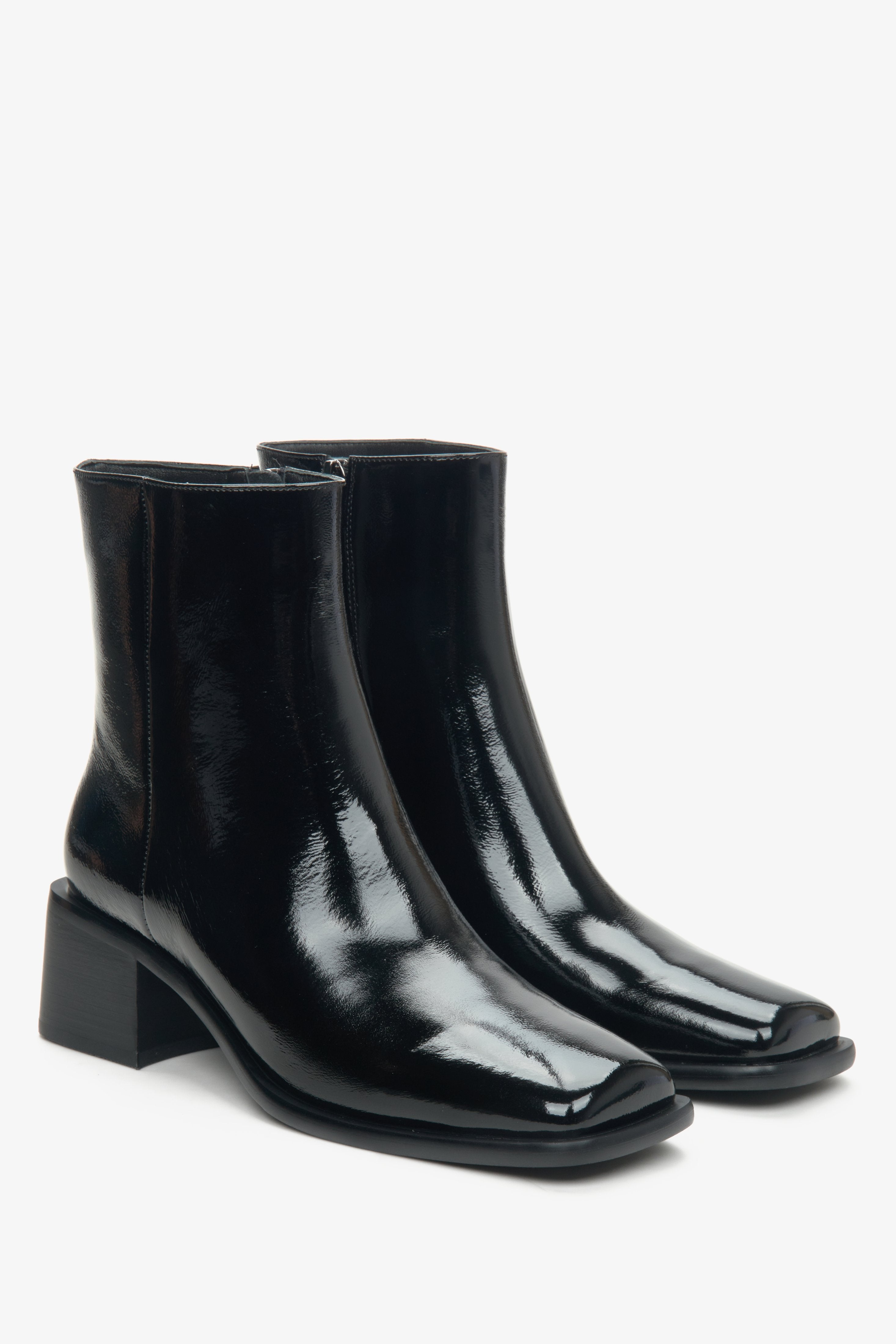 Women's black patent leather boots by Estro.