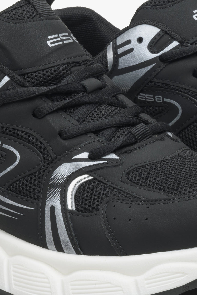 Women's black sneakers with silver details ES 8 - close-up on the seam line.