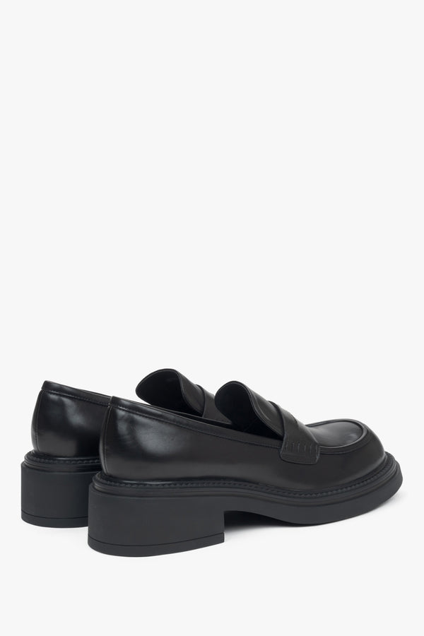 Estro women's black penny loafers with a square heel - close-up of the heel and side line of the shoes.