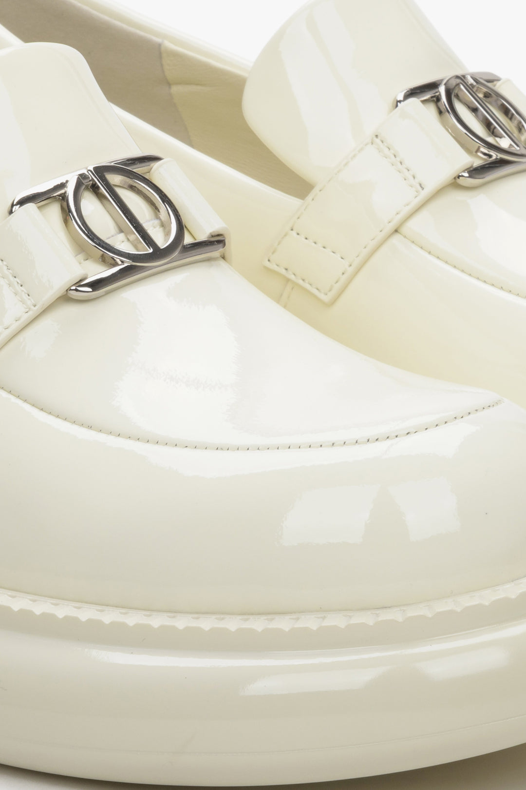 Patent leather light beige loafers - a close-up on details.