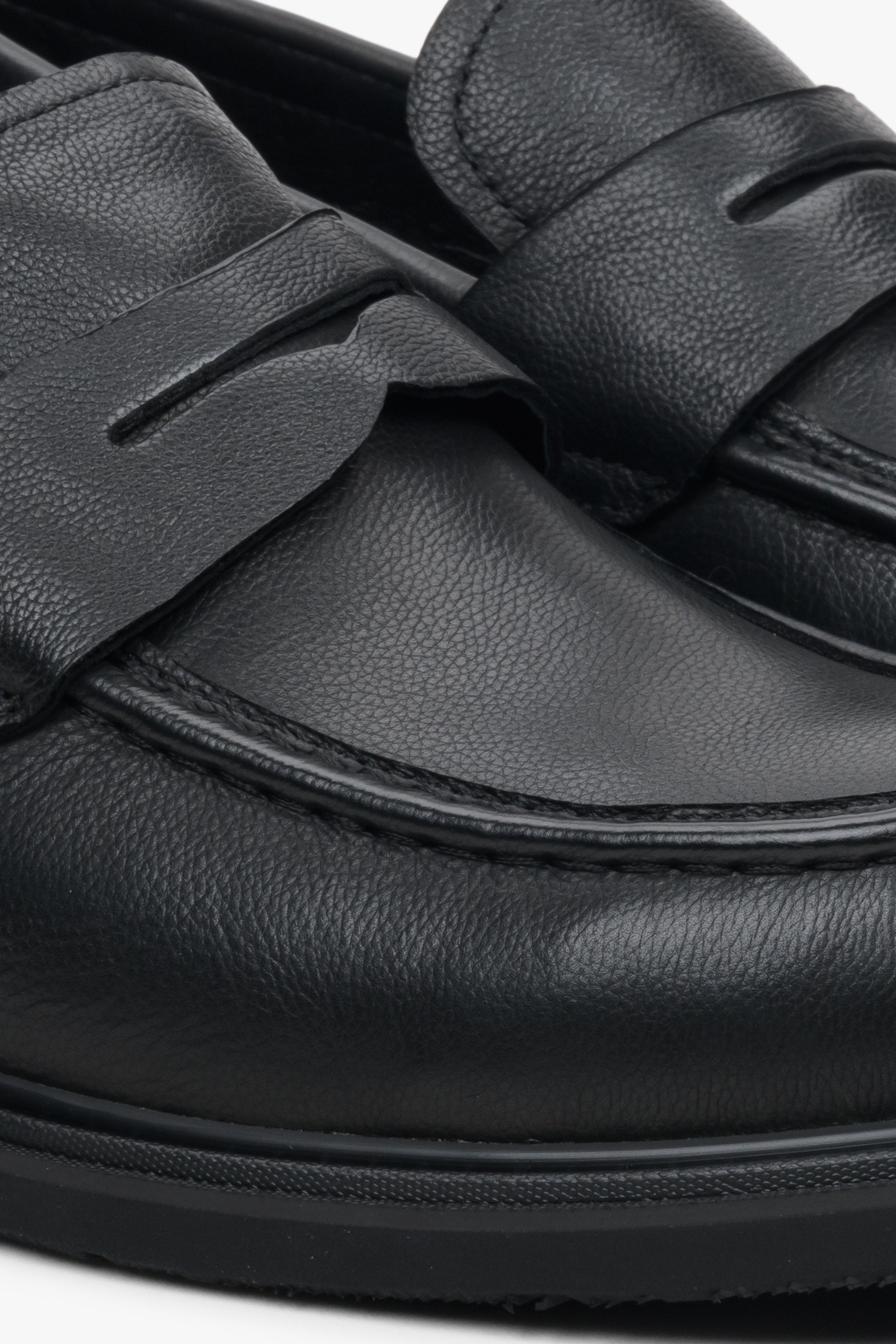 Men's black leather Estro loafers - close-up on the stitching pattern.