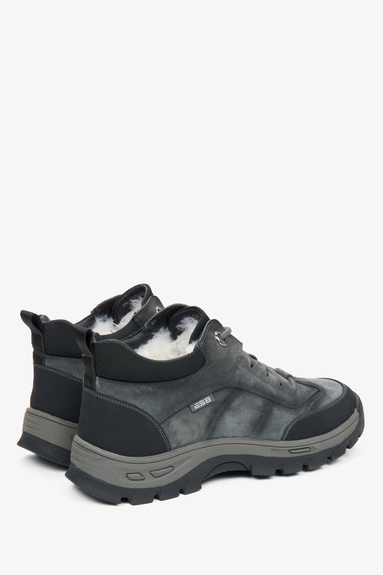 Dark grey high-top men's sneakers with insulation - close-up of the heel and side line of the shoes.