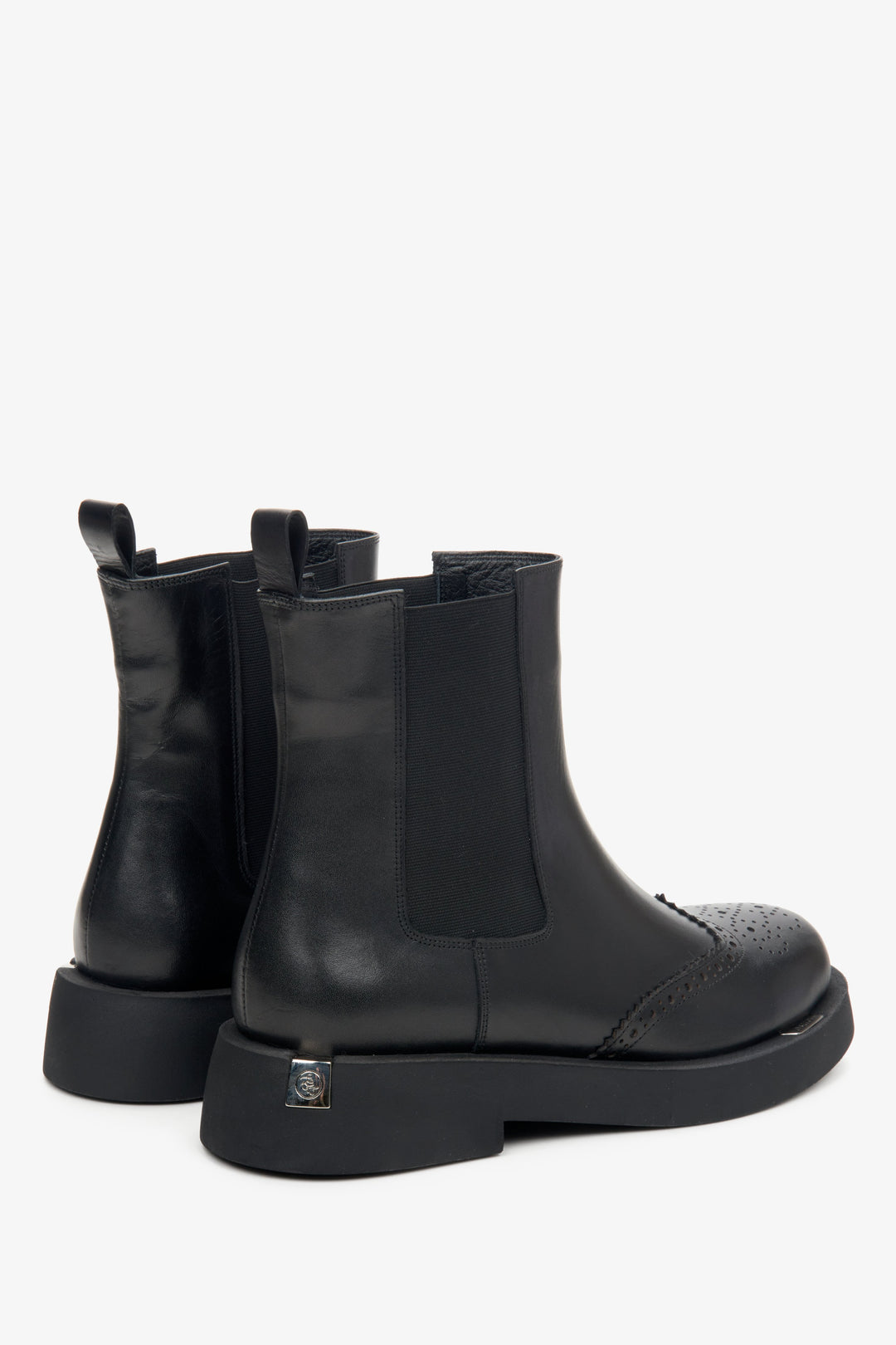 Women's black leather Estro Chelsea boots - close-up on the side seam.