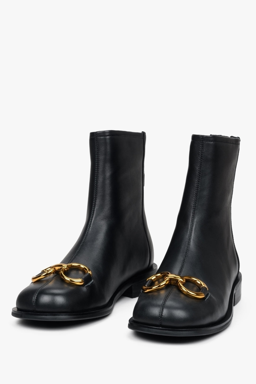 Women's leather boots for fall in black with a gold application by Estro. 