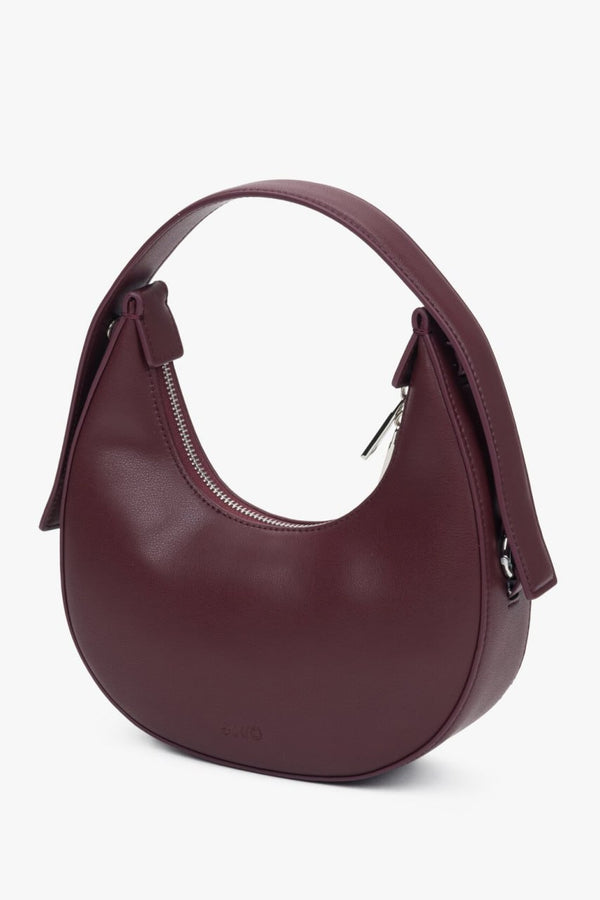 Burgundy and elegant crescent-shaped handbag, designed for women, from Estro.