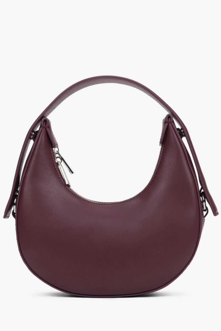 Burgundy women's handbag in a unique crescent shape, created by Estro.