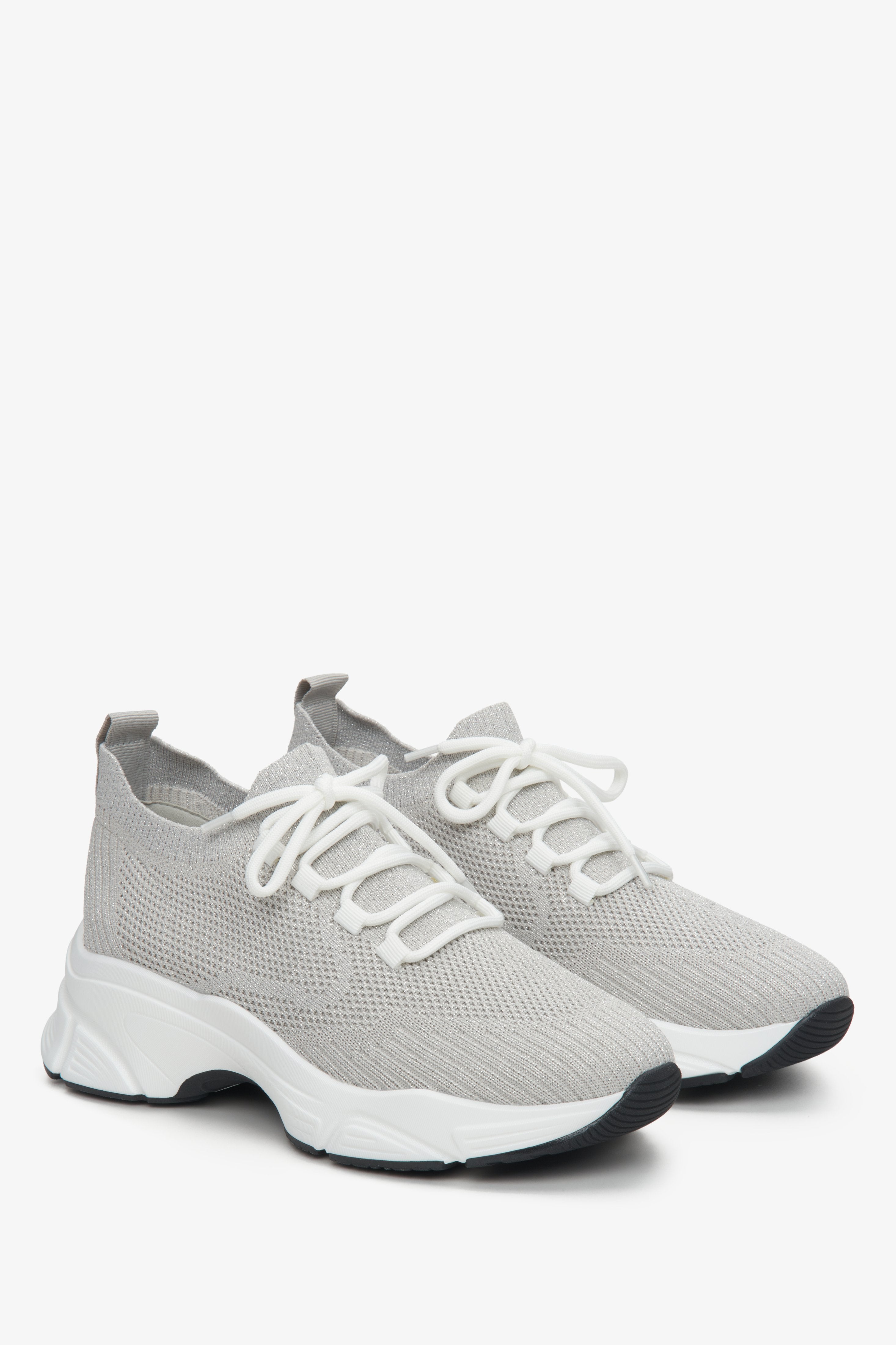 Grey mesh sneakers, laced, on elastic sole of Estro brand.