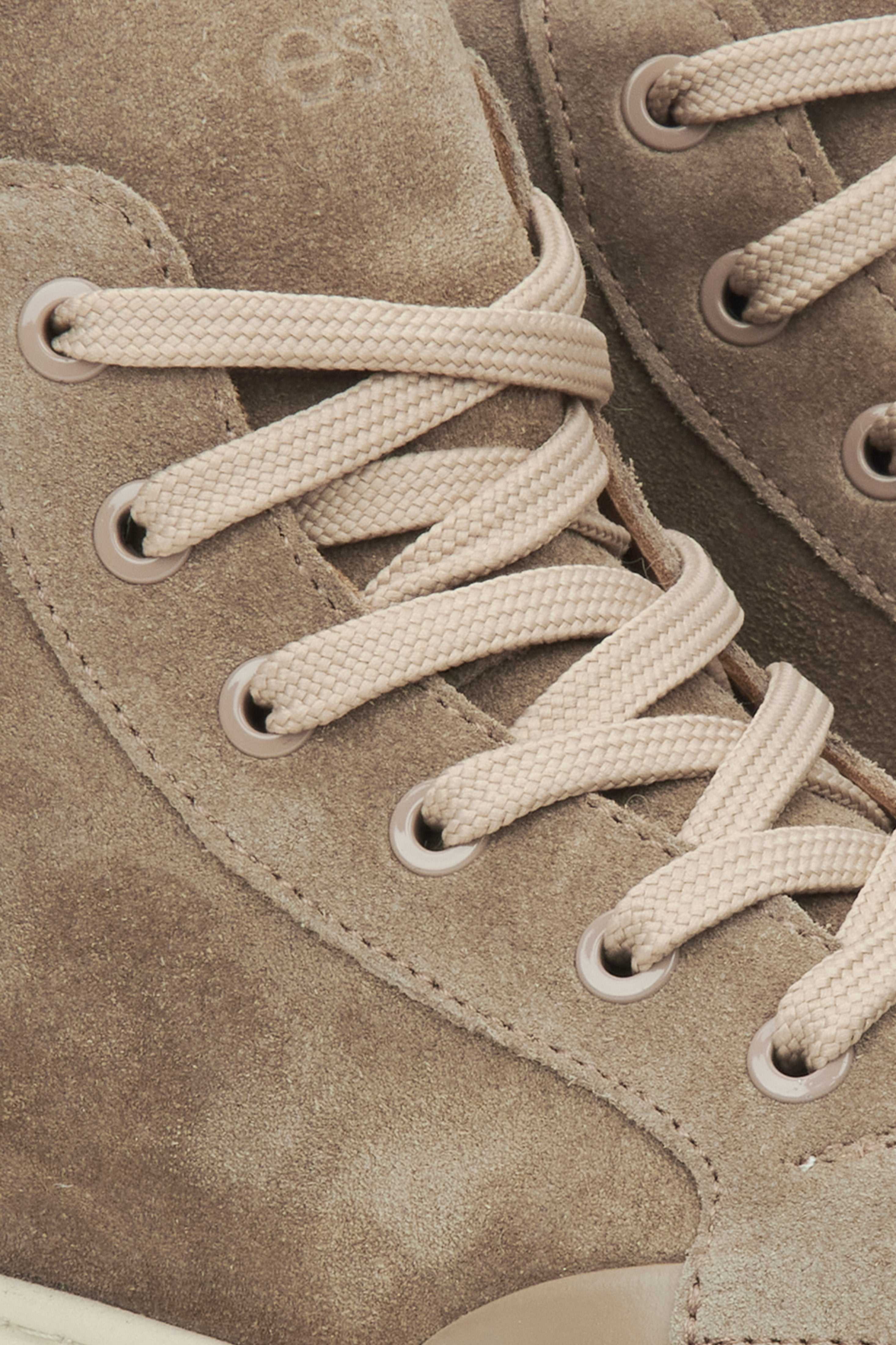 Beige high-top sneakers by Estro - details.