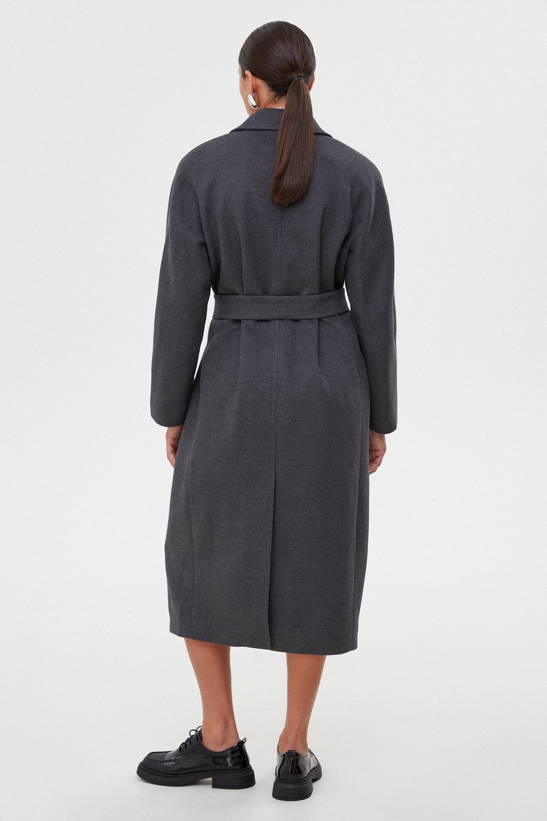 Women's grey bucket coat with a belt - back of the model.