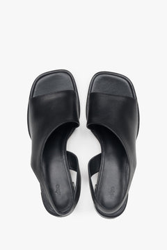 Black leather women's sandals by Estro, perfect for everyday wear, featuring a subtle low heel – top view presentation.