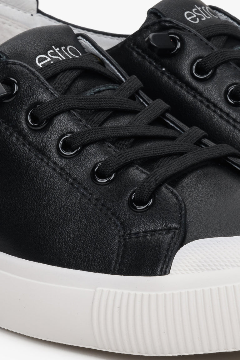 Women's black leather sneakers by Estro with laces for spring - close-up on the details.