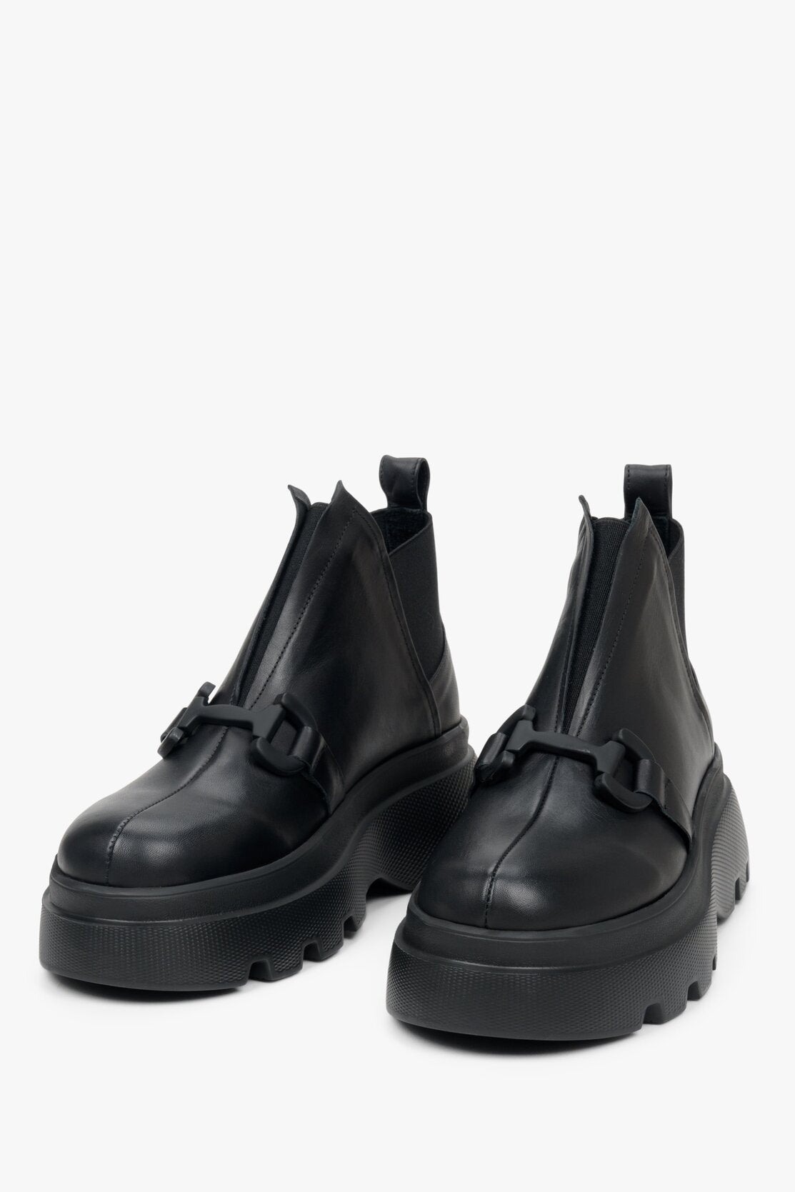 Women's black boots with a buckle for fall made of natural leather - presentation of shoe toe.