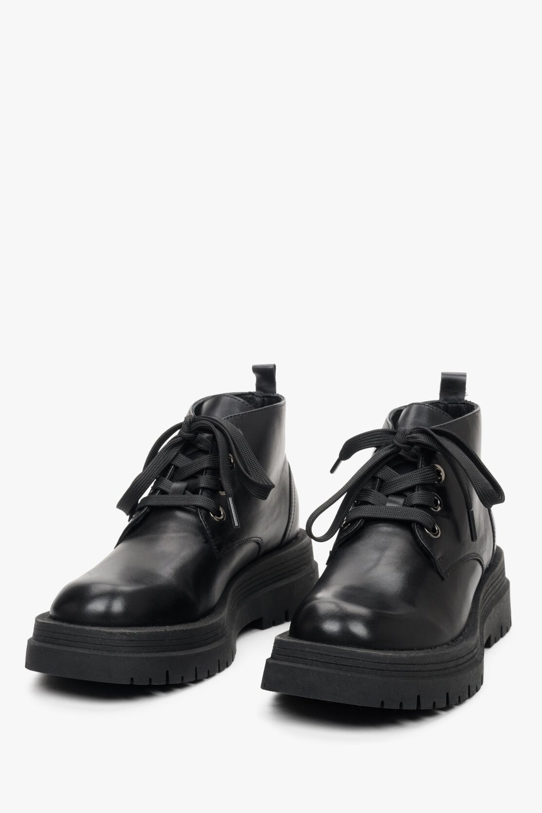 Women's black ankle boots on a platform with a higher shaft for fall by Estro - presentation of shoe toe.