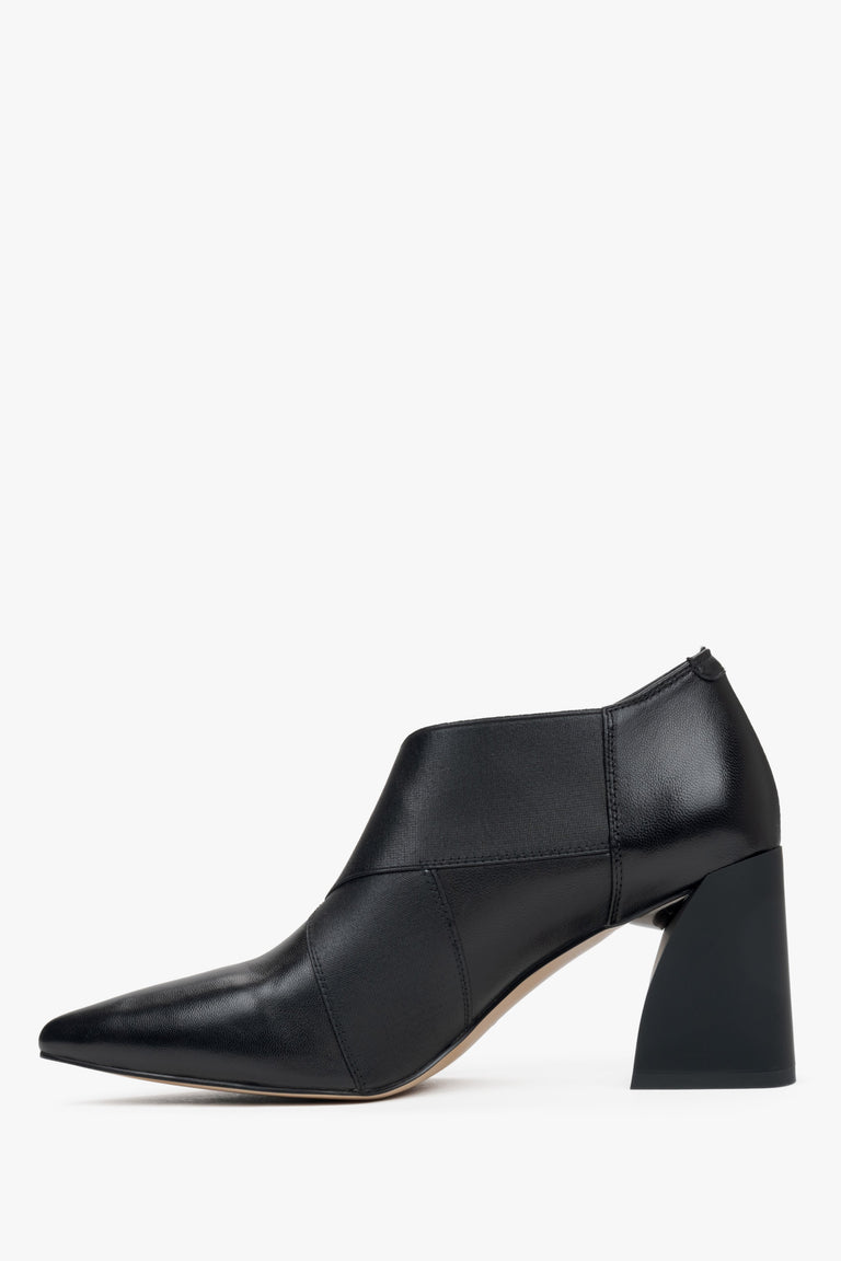 Black low-top ankle boots for women with a stable block heel and pointed toe - side profile.