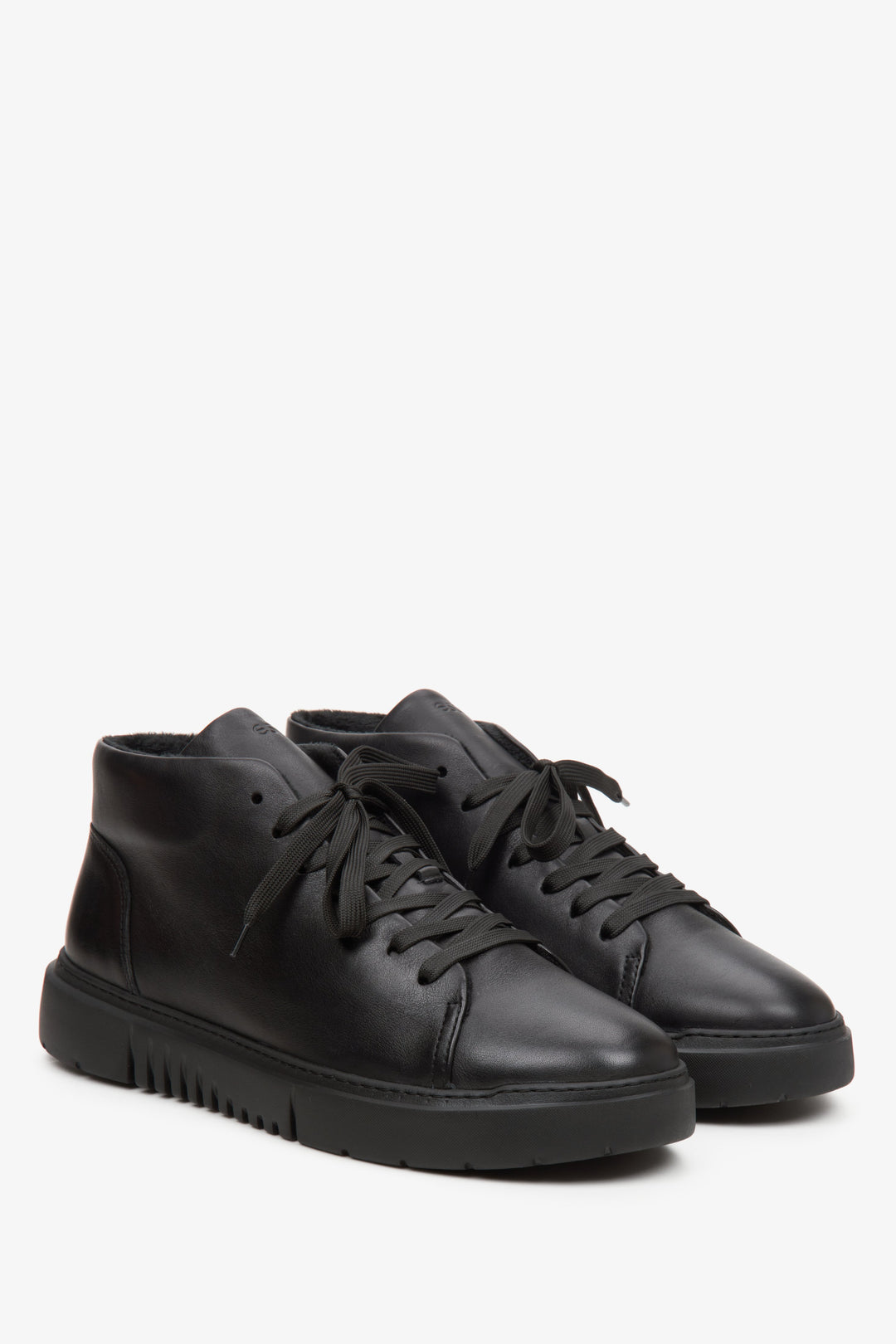 Black, leather, high-top Estro men's sneakers - close-up on the toe and side seam.