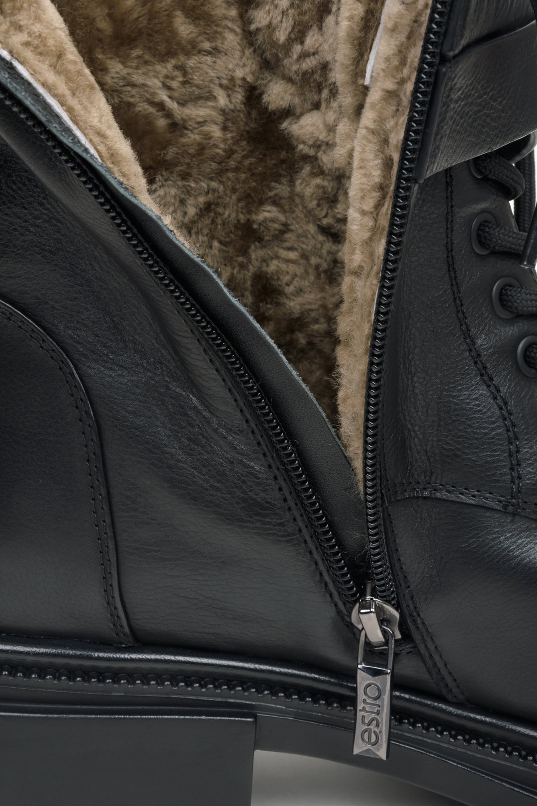 Women's black leather boots with fur lining by Estro - close-up on details.