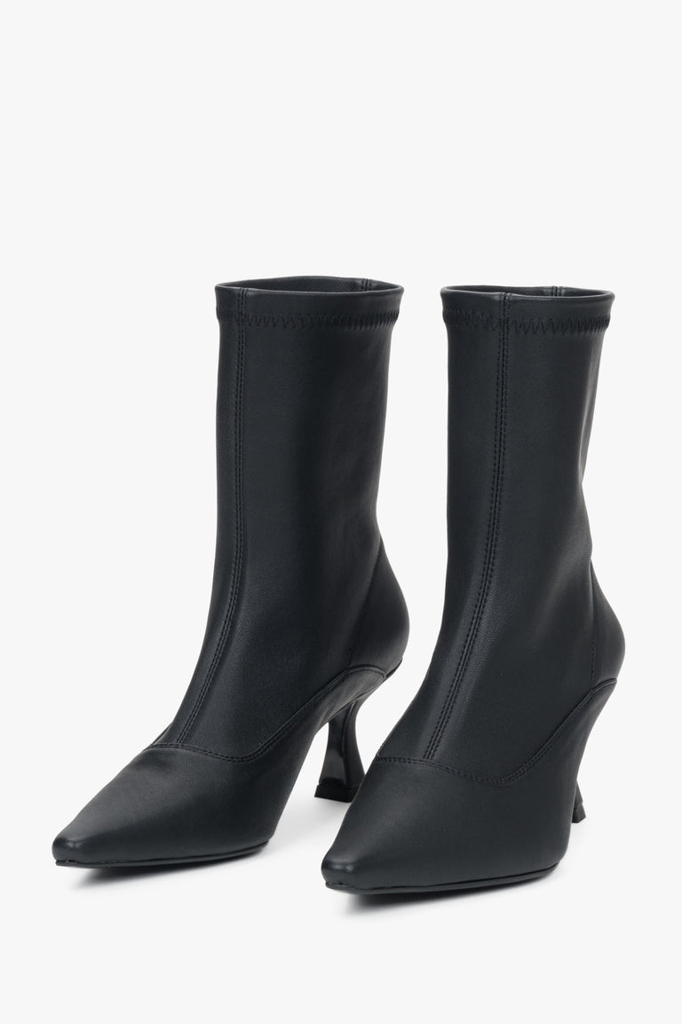 Women's black ankle boots by Estro with a soft shaft and heel.