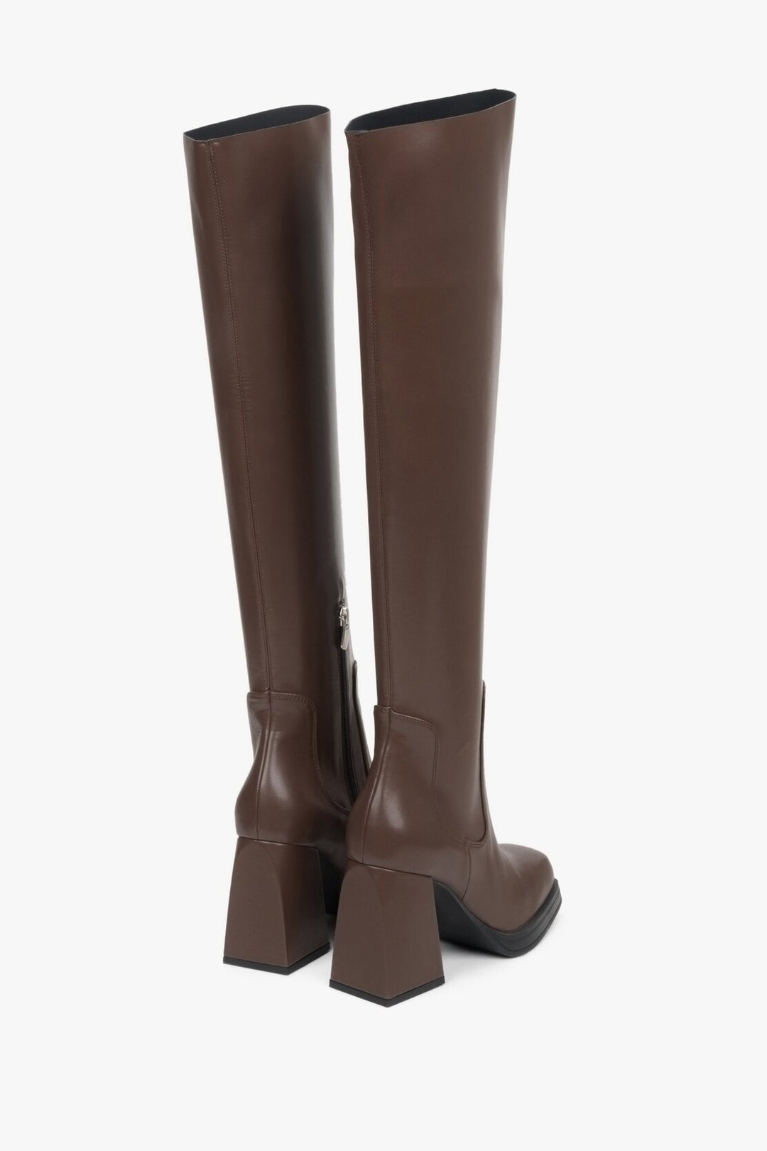 Elegant saddle brown women's boots genuine leather - presentation of a shoe toe and sideline.