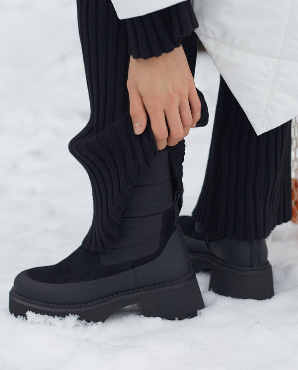 Soft velour and leather ankle boots in black.