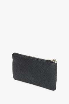 A black Estro leather key case.