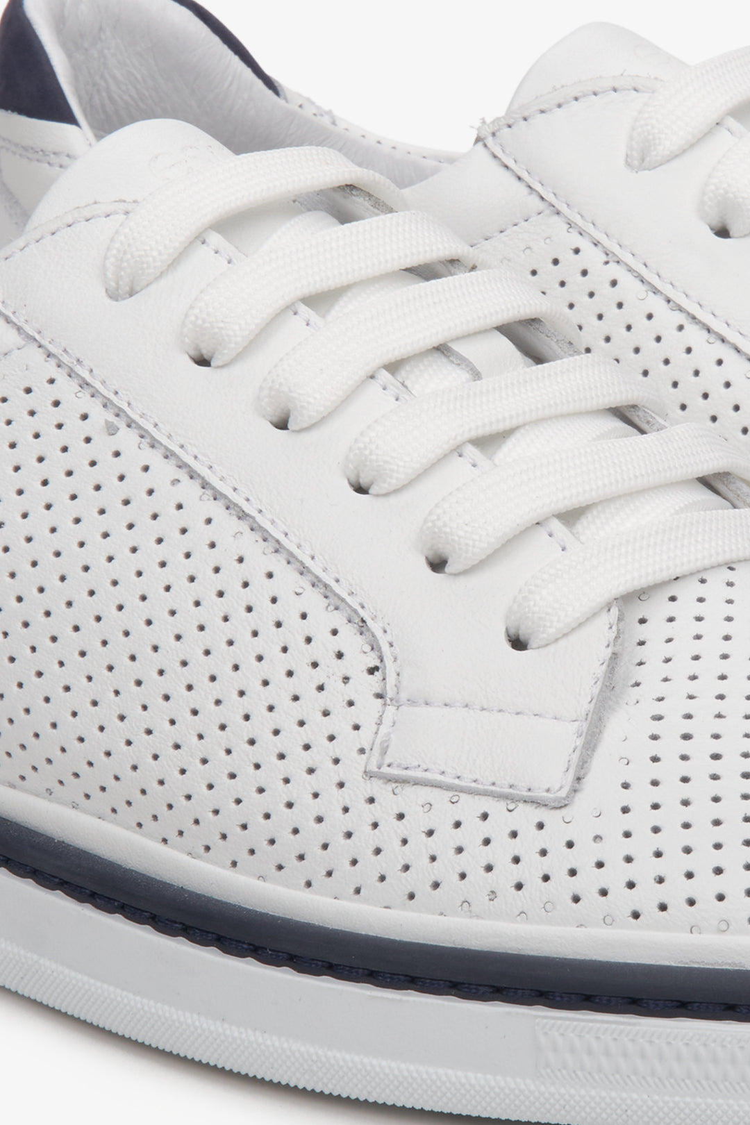 Estro men's sneakers in white with perforations and lacing for summer - close-up on details.