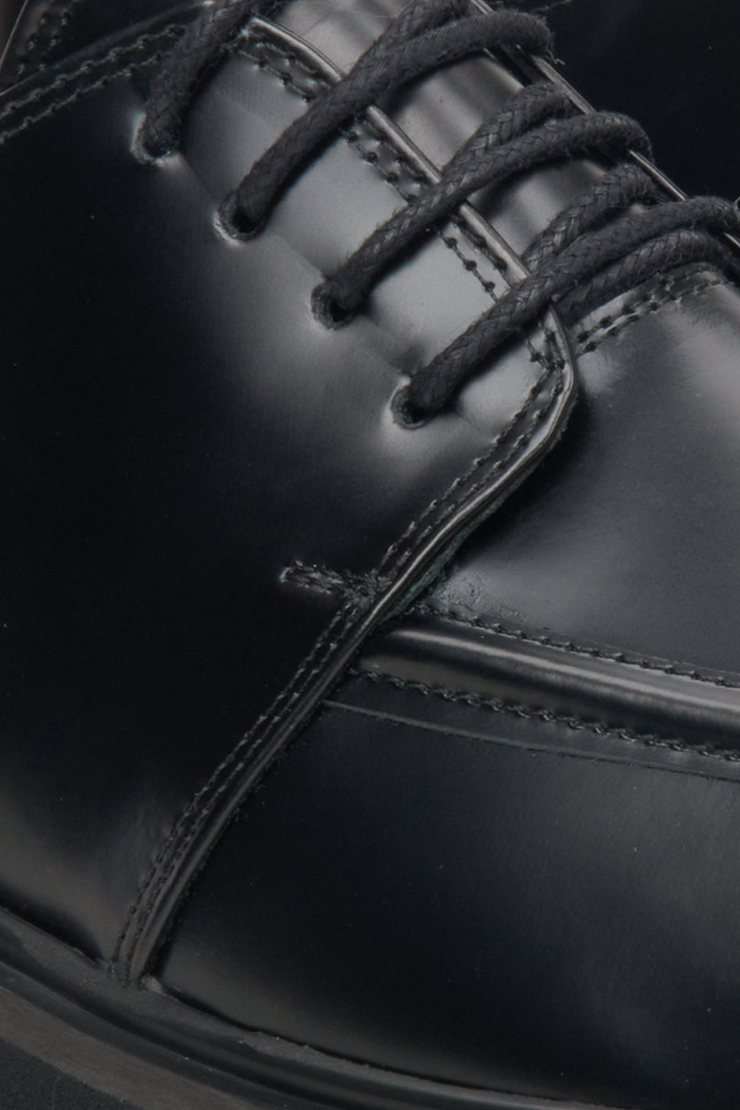 Women's black leather lace-up shoes by Estro - close-up on details.