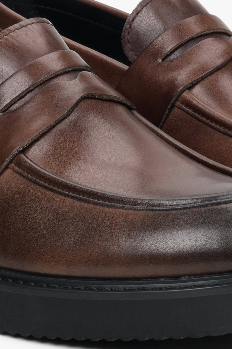 Men's dark brown leather Estro loafers - close-up on the stitching pattern.