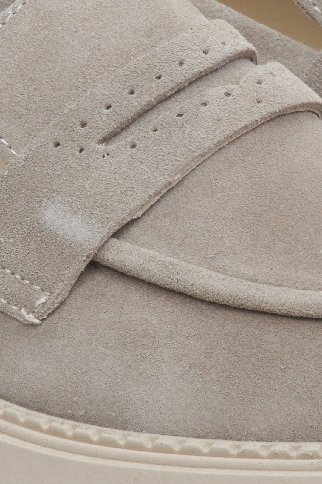 Grey women's loafers by Estro - a close-up on the sewing line.