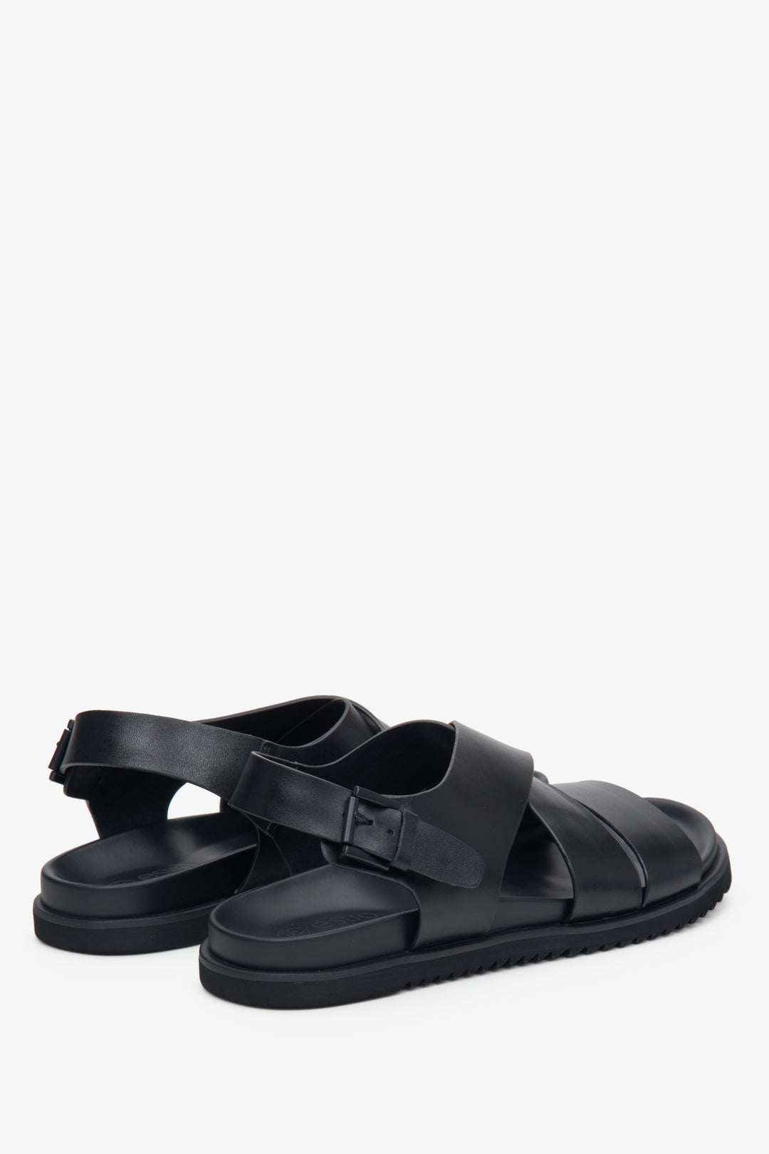 Men's black leather sandals by Estro with thick, crisscrossed straps - close-up of the side stitching and heel.