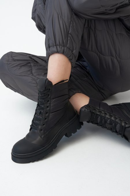 Black women's lace-up platform boots for winter - presentation on model.