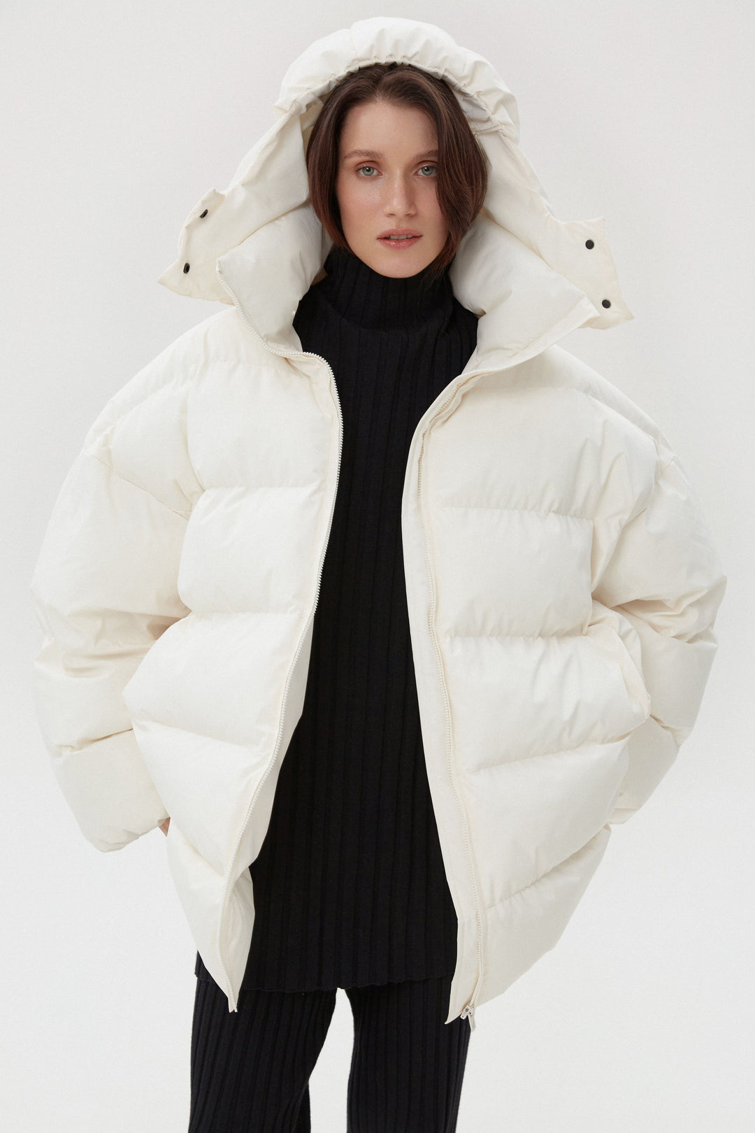 Light beige women's puffer jacket with a high collar Estro.