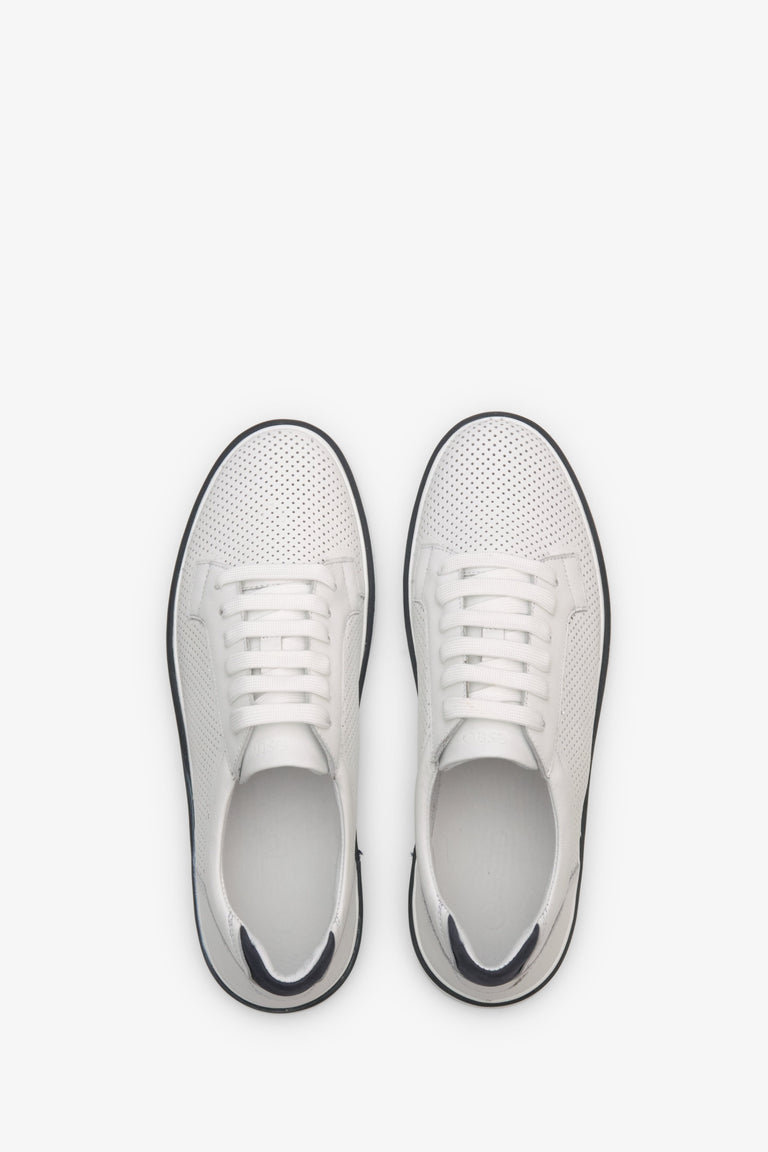 Men's leather sneakers for summer in white color with perforation - presentation of shoes from above.