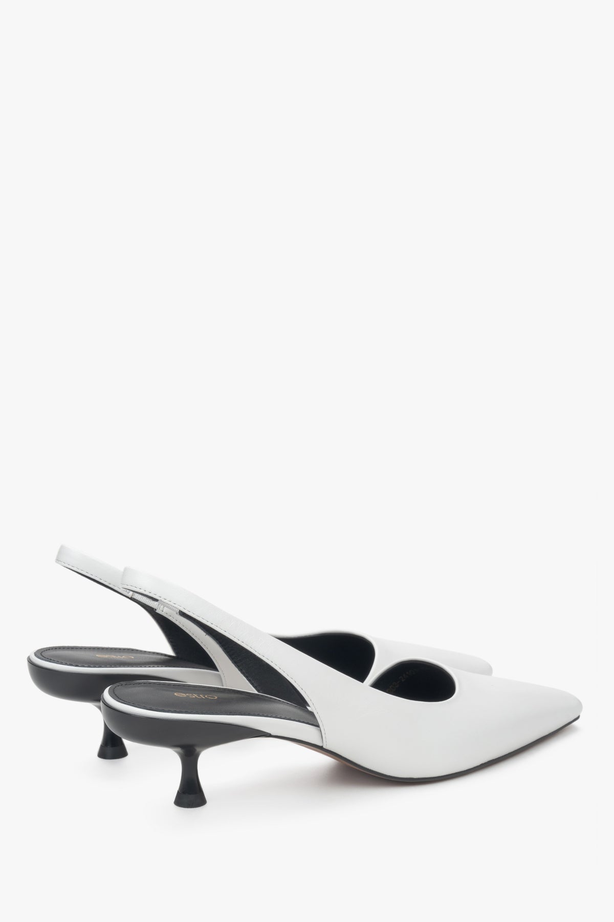 White slingback pumps with a low heel, made of genuine leather by Estro.
