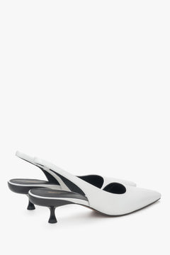 White slingback pumps with a low heel, made of genuine leather by Estro.
