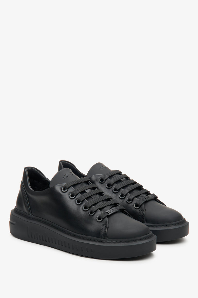 Women's black sneakers made of genuine leather with laces.