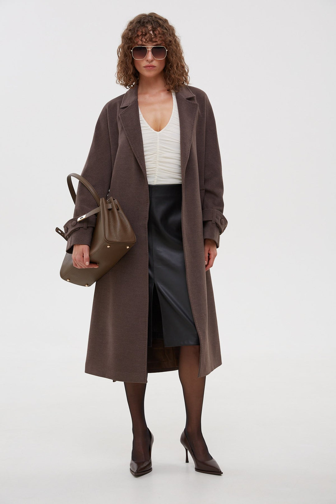 Long classic saddle brown coat with a belt by Estro.