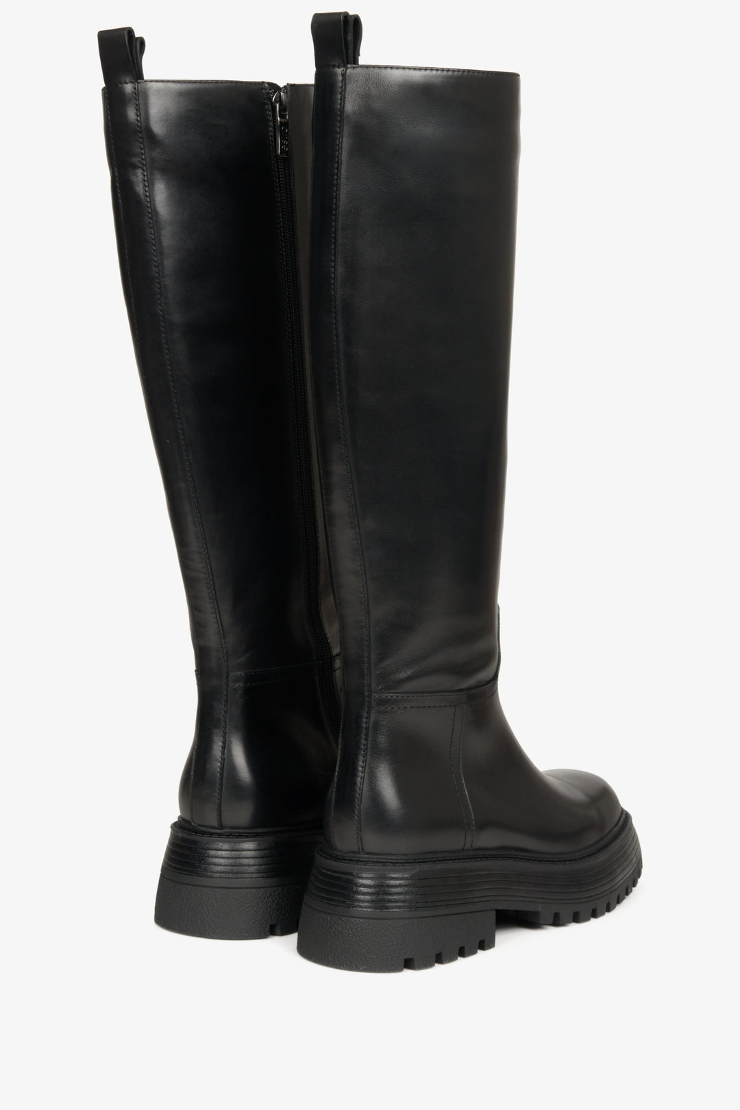 Elevated, women's spring boots made of black genuine leather by Estro - close-up of the heel and the back part of the shaft.