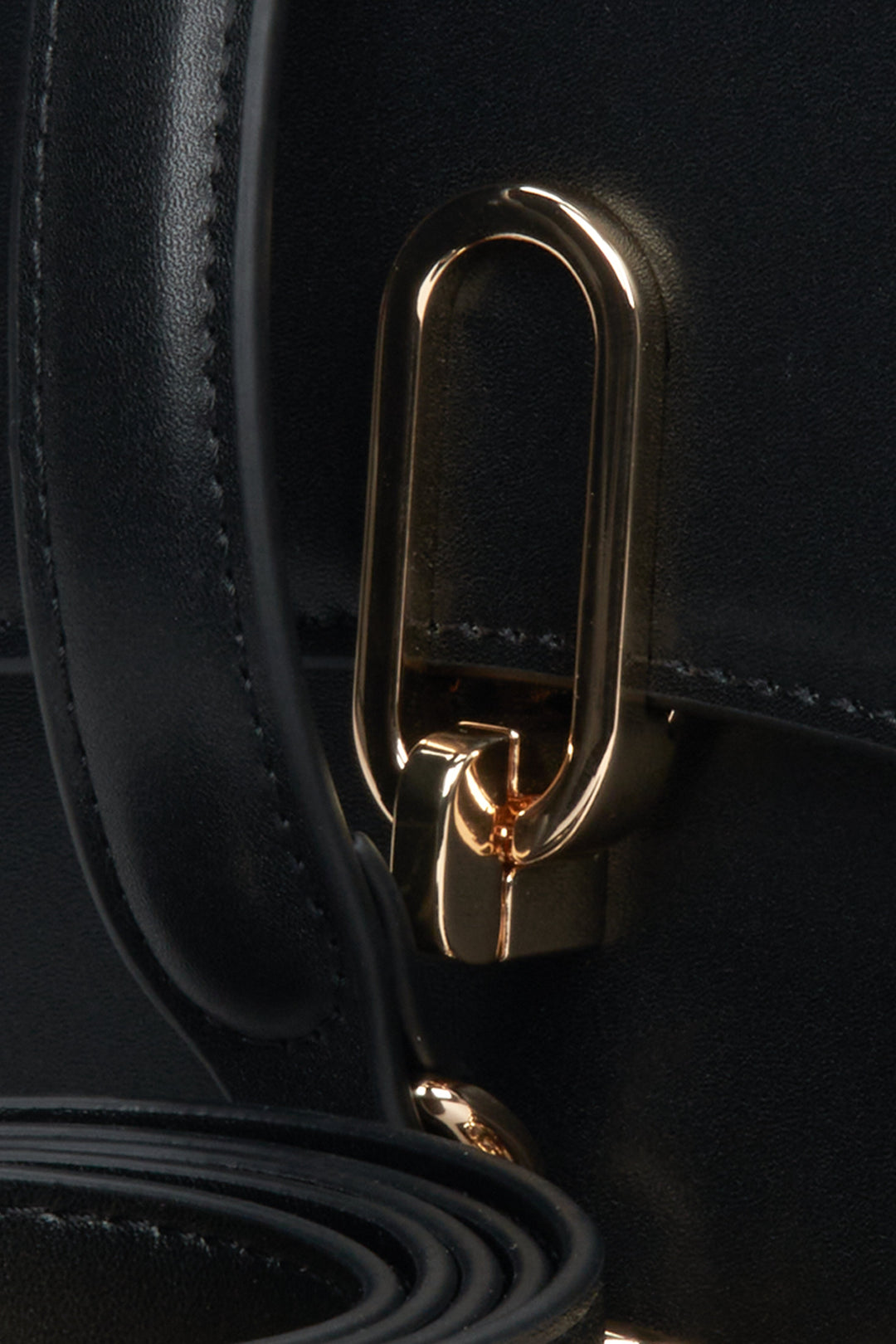 Stylish, black women's handbag Estro made of genuine leather - close-up on details.