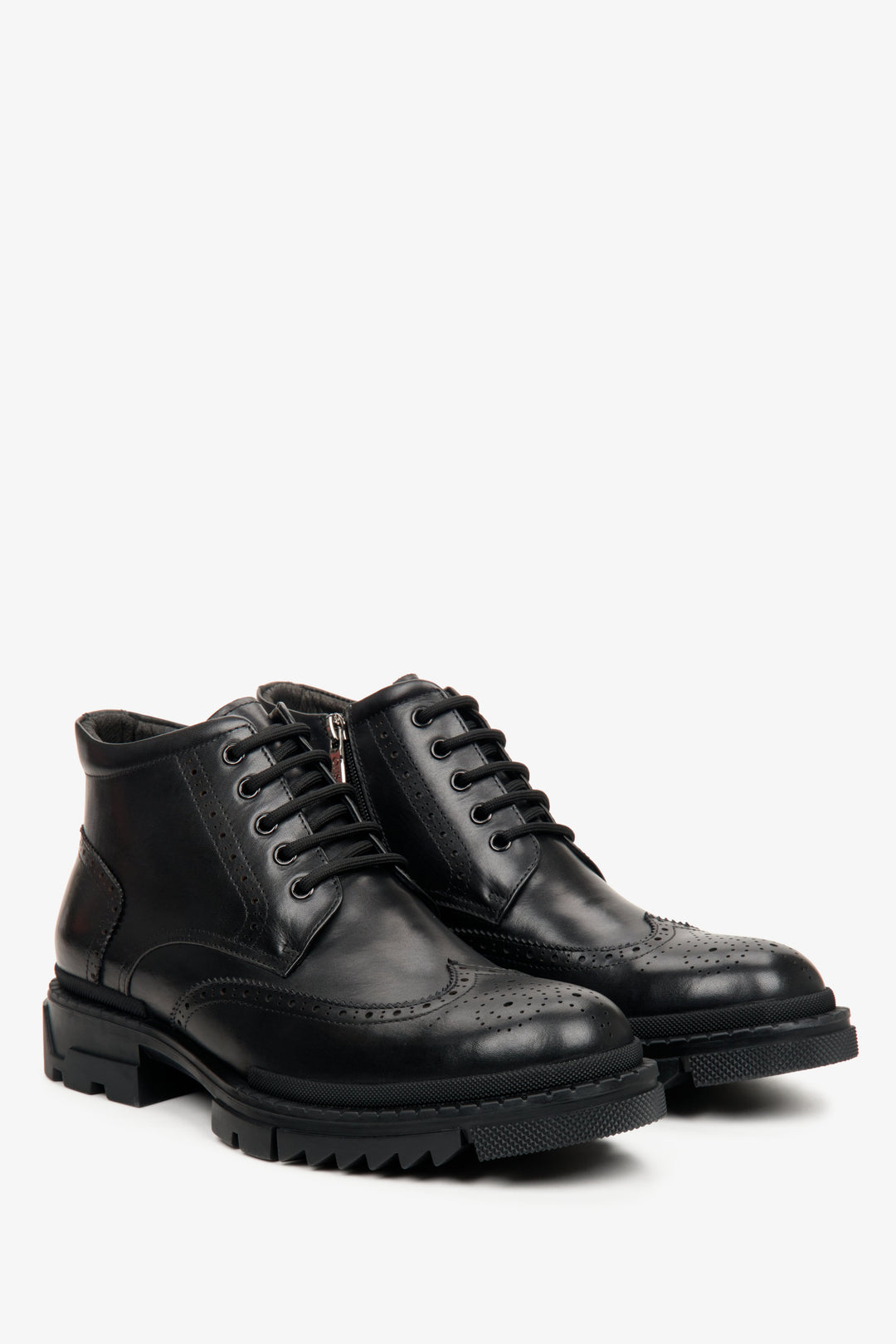 Men's black winter ankle boots made of genuine leather - close-up of the side profile and toe of the shoe.