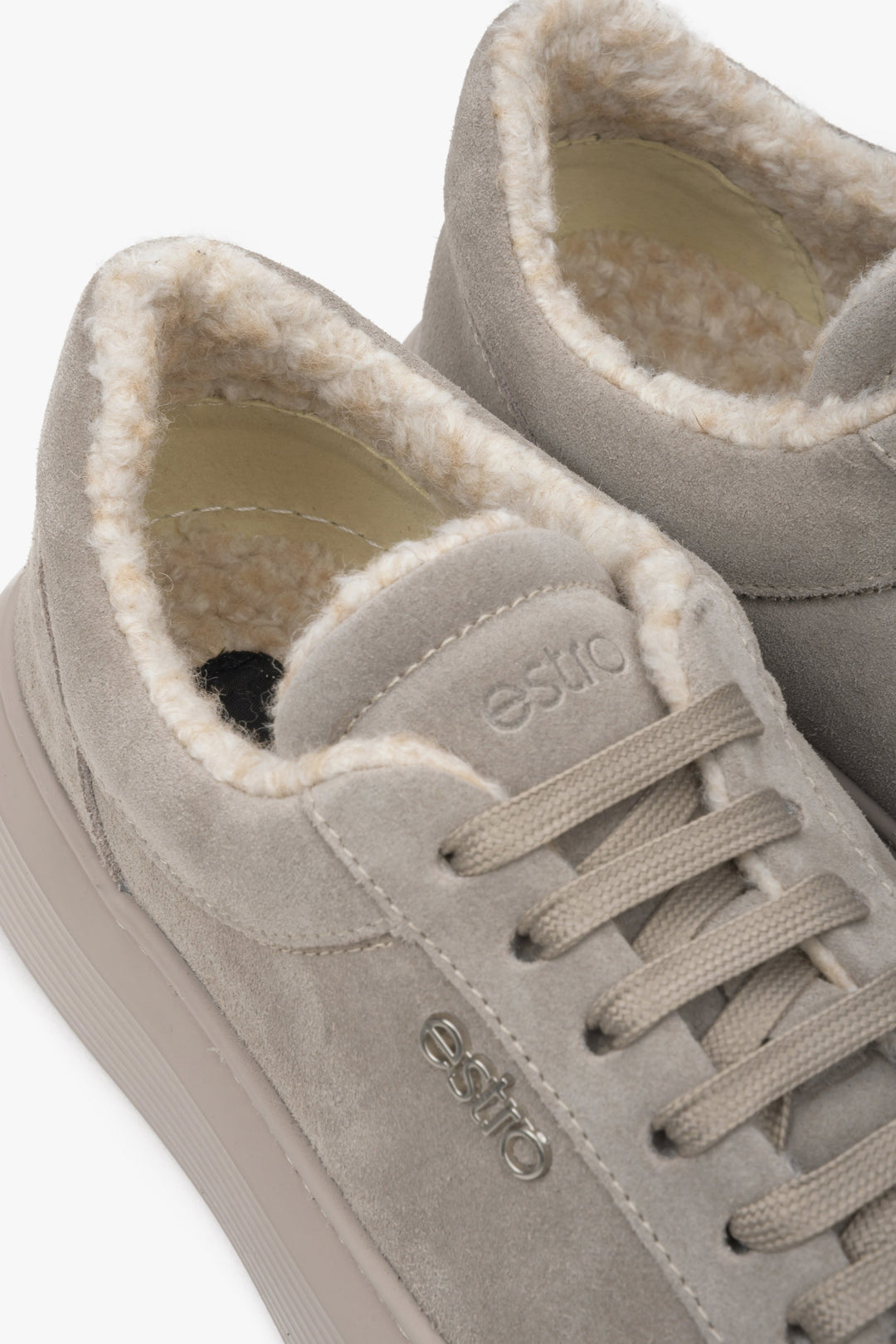 Grey, insulated low-top sneakers made of genuine Italian suede - close-up on details.