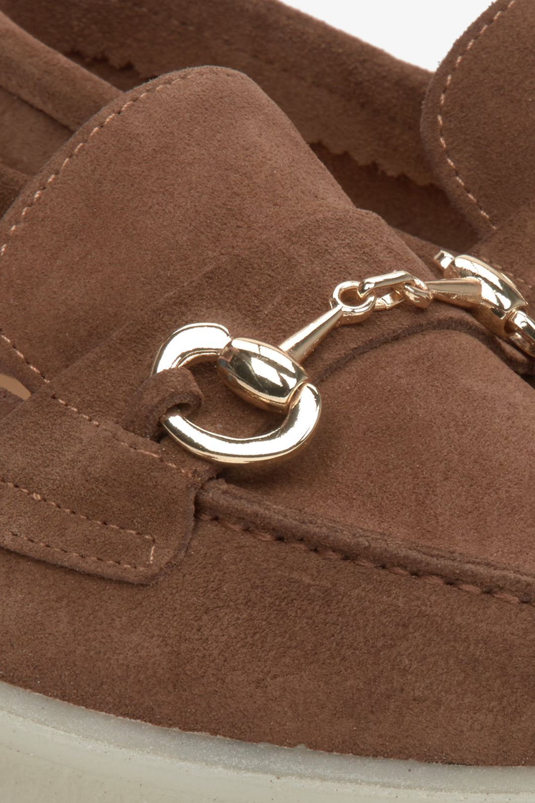 Estro saddle brown women's loafers with gold buckle - close up on details.